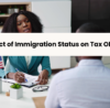 A professional woman discussing tax obligations with a client.
